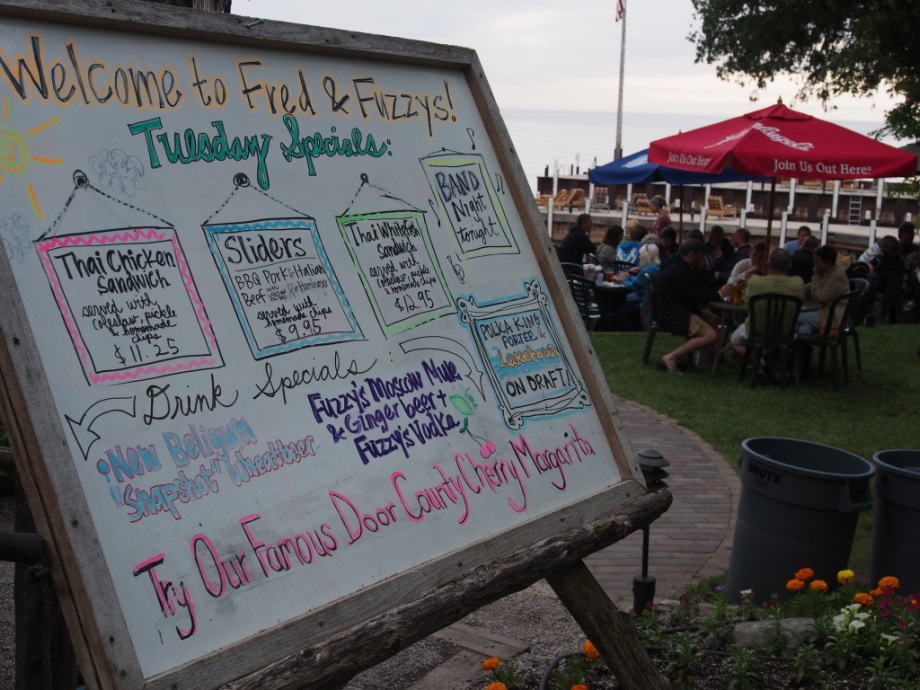 Fred & Fuzzy’s Daily Specials board, featuring live music on Tuesdays